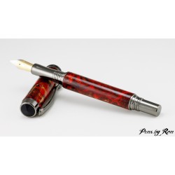 Custom made fountain pen with a fiery red resin and gunmetal accents